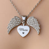 A close-up of the CapeGlow® Angel Wings Heart Necklace hanging delicately against a soft, neutral background, highlighting the intricate zircon details and the personalized engraving area, with gentle lighting to emphasize the shine and craftsmanship.