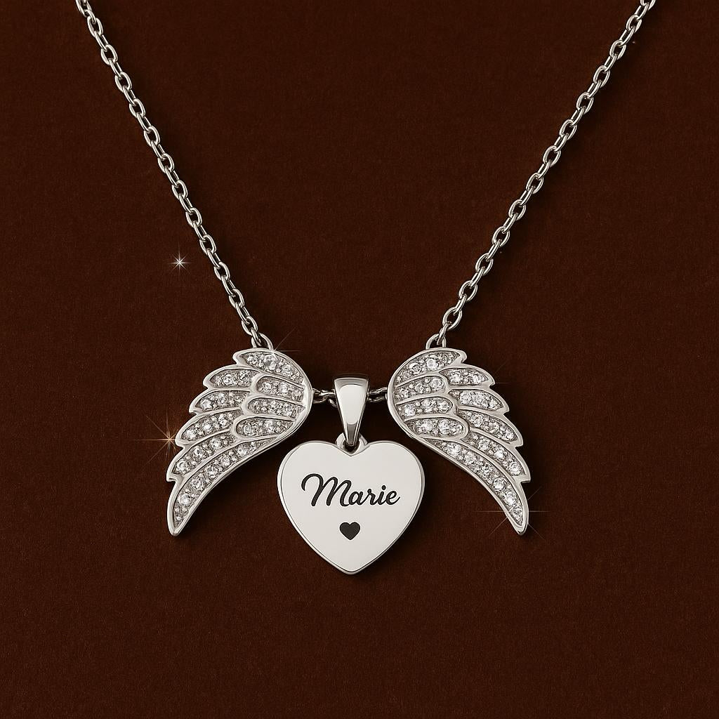 An elegant top-down studio shot of the necklace laid flat on a luxurious velvet surface, showcasing the heart with angel wings pendant, the chain length, and the engraved area, with a subtle sparkle effect on the zircon details.